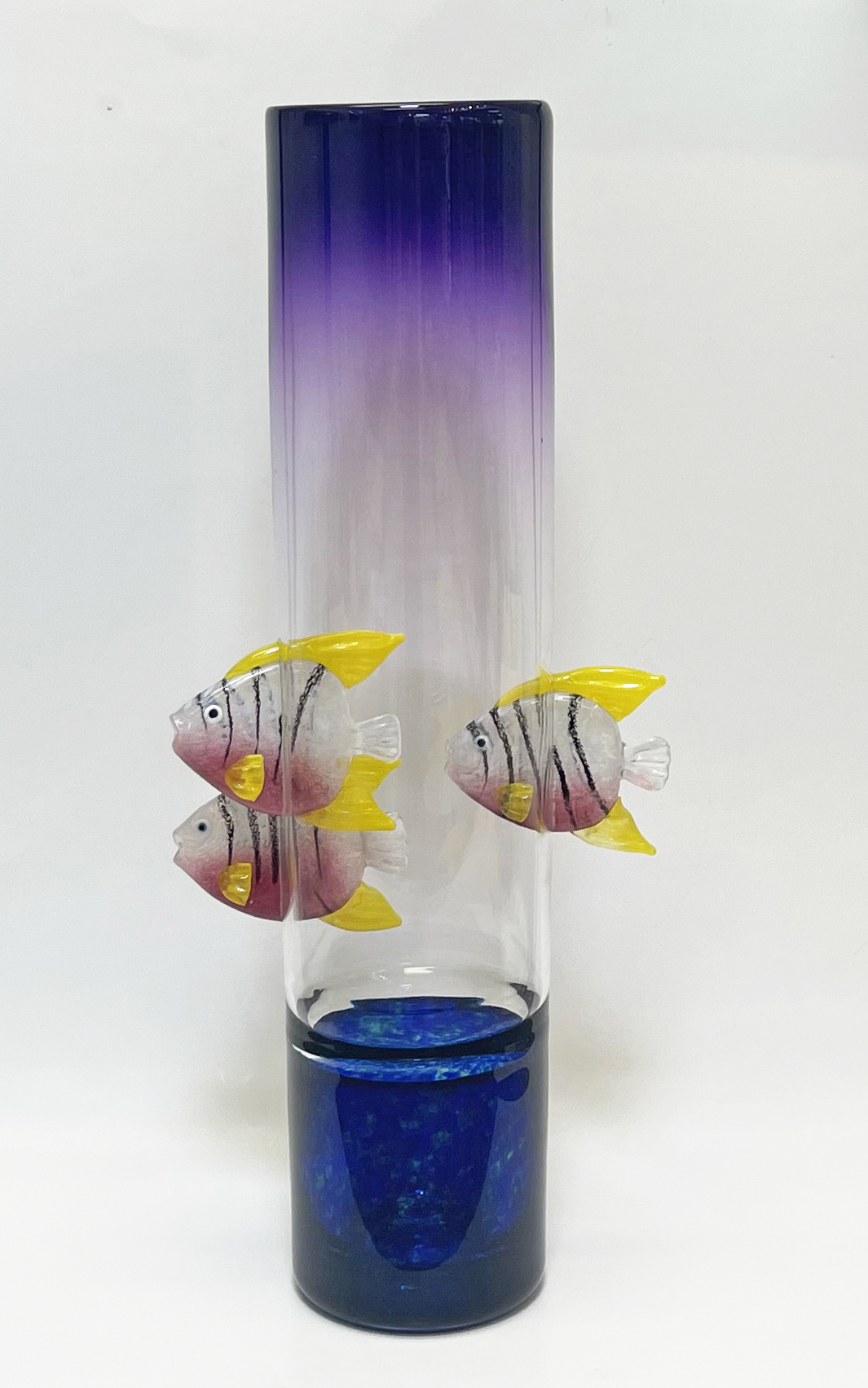Unique art glass vase with handmade glass fish seemingly swimming through.
